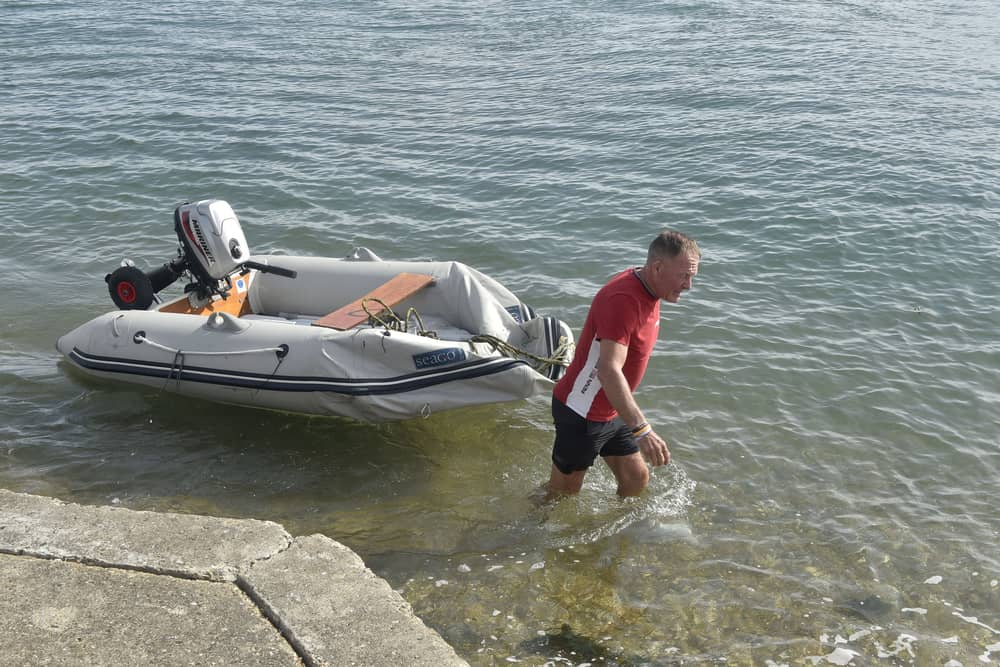 The aftermath at the RNLI in Ferry Road, Eastney, Portsmouth, on Monday, September 7, 2026, after hundreds of protestors descended on Portsmouth vowing to prevent 140 migrants who arrived in a small boat stepping onto dry land. 

Pictured is: Local singer Barry Williams retrieving his boat.

Picture: Sarah Standing (070926-6965)