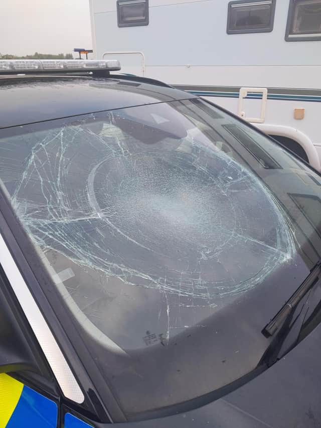 Police car damaged by protesters in Eastney