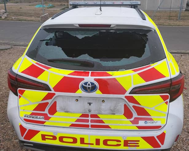Police car damaged by protesters in Eastney
