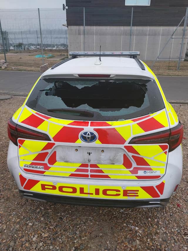 Police car damaged by protesters in Eastney