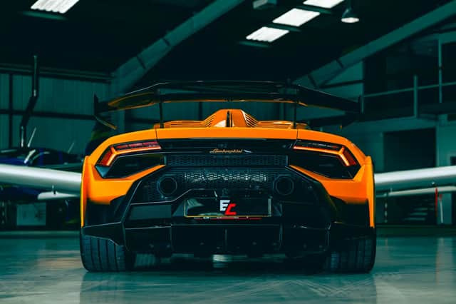 The car features extensive carbon-fibre bodywork, an adjustable rear wing and carbon-ceramic brakes.