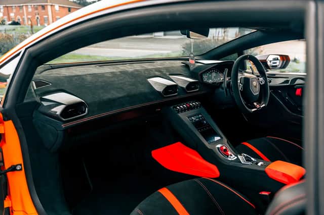 Finished in orange with green STO graphics, the Lamborghini has covered 5,560 miles.