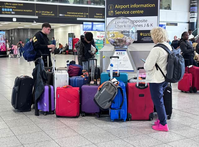 Passengers wait at Gatwick Airport in Crawley, West Sussex, during disruption after a system issue hit Nats, which provides air traffic control services to 15 UK airports.
