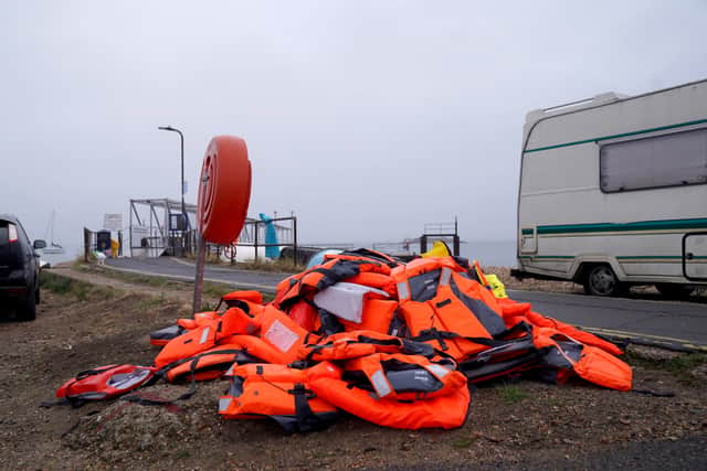 Discarded life jackets at Eastney Point, near Eastney Beach, Portsmouth, following a protest after people thought to be migrants were brought into the harbour (PA)