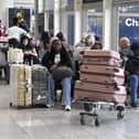 Passengers wait at Gatwick Airport during disruption after a system issue hit Nats