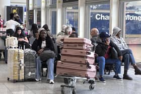 Passengers wait at Gatwick Airport during disruption after a system issue hit Nats