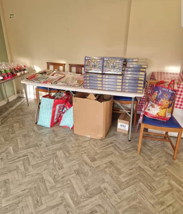 Children get presents and goodies at the annual Christmas party