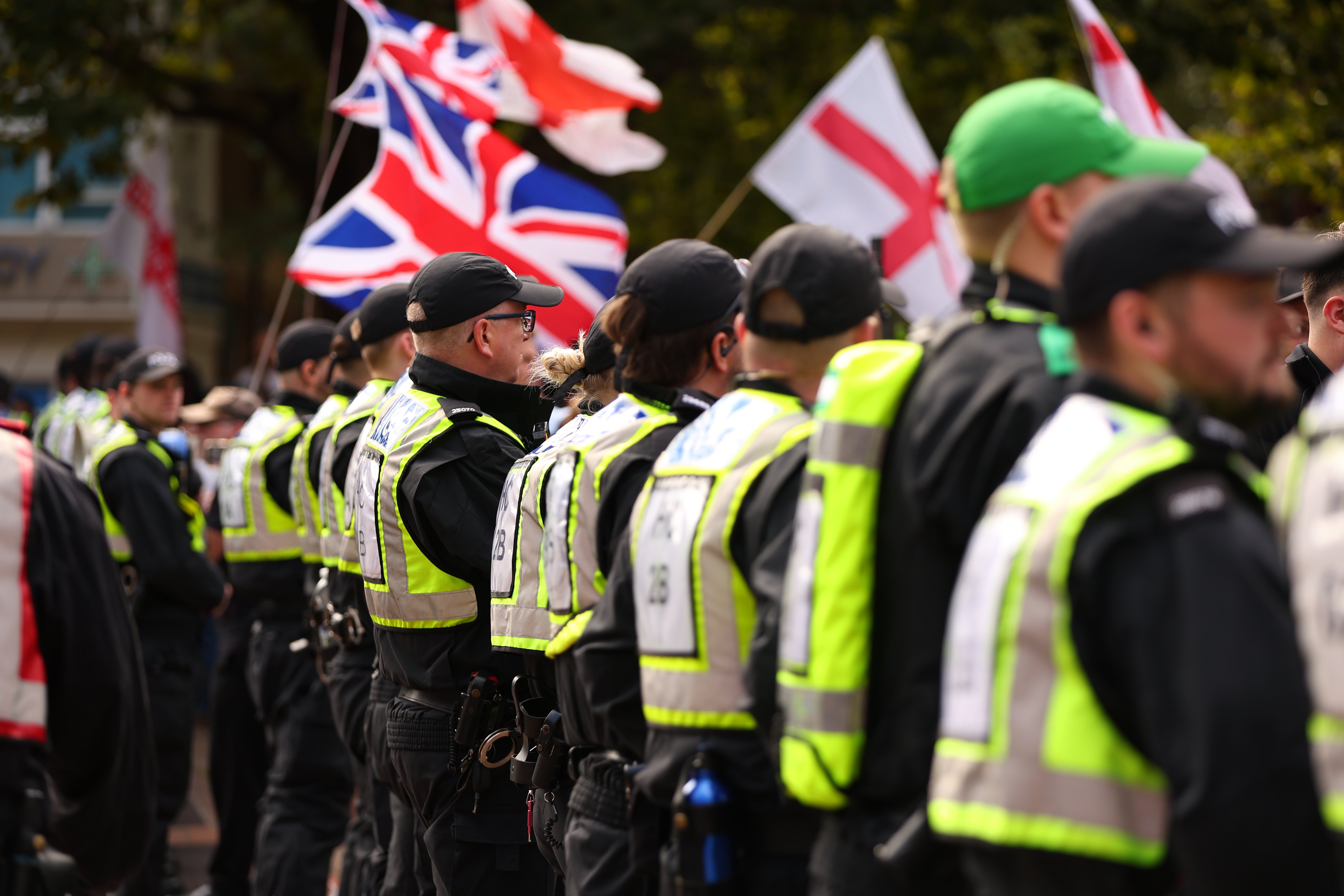 Two men charged after rival protestors marched through the city, police confirm