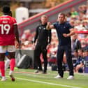 Charlton boss Nathan Jones and former Pompey loanee Milli Alli. Pic: Jason Brown