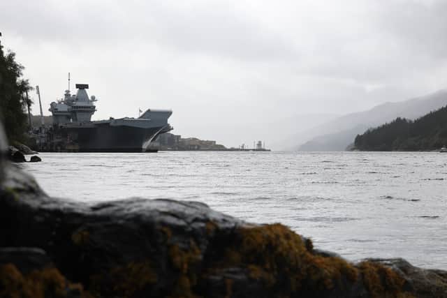 HMS Queen Elizabeth alongside Glen Mallan before heading to Edinburgh.