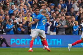 Colby Bishop celebrates with Ryan Kavuma-McQueen after he rescued a point for Pompey against Blackburn Rovers