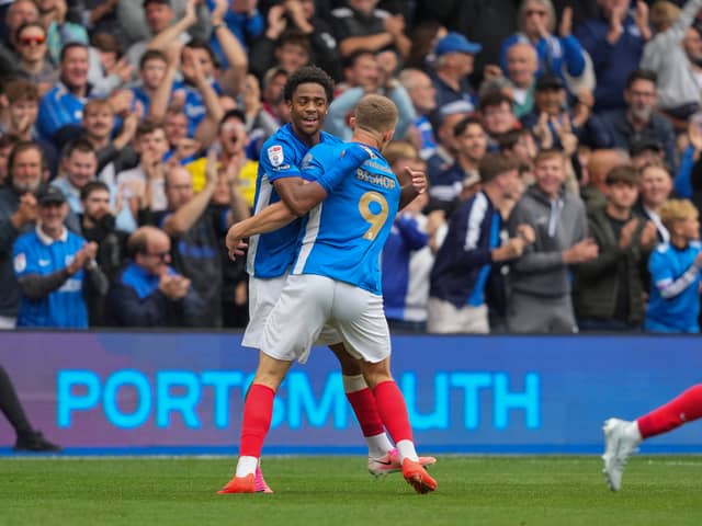 Colby Bishop celebrates with Ryan Kavuma-McQueen after he rescued a point for Pompey against Blackburn Rovers