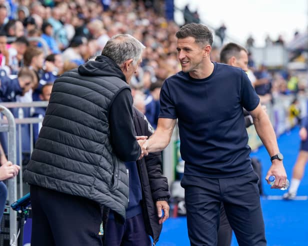 Blackburn boss Tony Mowbray with John Mousinho. Pic: Jason Brown