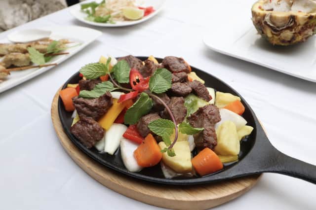 Beef luc lac sizzling, served at Viet Pot and Bar