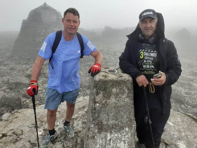 Rob Prior (L) and Danny Brain at the summit of Ben Nevis in Scotland