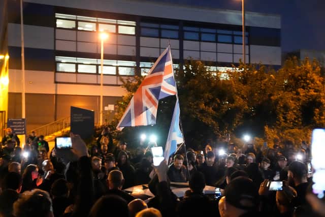 Protesters gathered outside the Hampshire Constabulary Police Investigation Centre in Basingstoke following the arrest of far-right activist Daniel Thomas, also known as Danny Tommo, after he allegedly slashed the side of a dinghy in the English Channel with a rescue crew member still on board. Picture: PA Wire