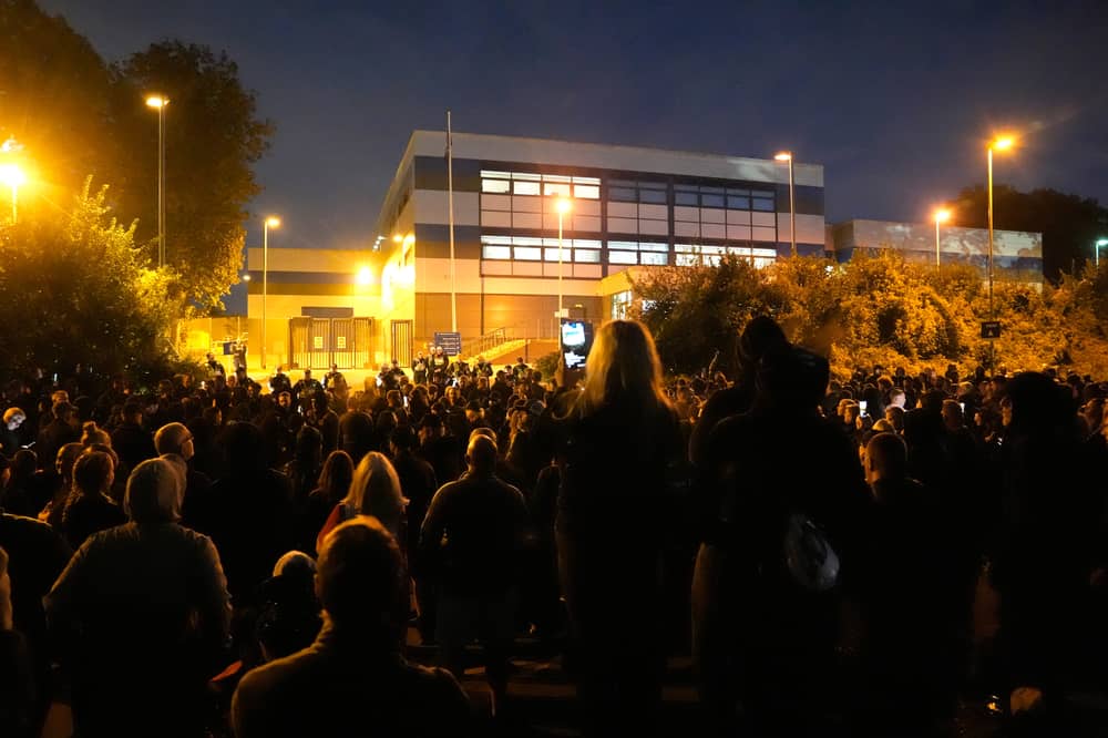 Protesters gathered outside the Hampshire Constabulary Police Investigation Centre in Basingstoke following the arrest of far-right activist Daniel Thomas, also known as Danny Tommo, after he was filmed slashing the side of a dinghy in the English Channel with a rescue crew member still on board. Picture: PA Wire