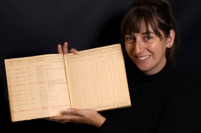 Militaria specialist Jessica Tarver with Leslie Valentine's D-Day logbook.