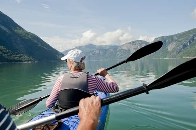 Holidaymakers can go kayaking in the Norwegian fjords.