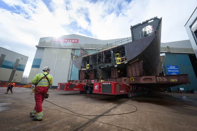 The impressive sight of a large section of HMS Sheffield being manoeuvred on a transporter.
