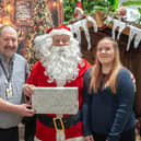 Havant Garden Centre Xmas Area in Havant.  David Craighead, Santa and Primrose Edwards. Picture: Alec Chapman
