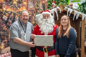 Havant Garden Centre Xmas Area in Havant.  David Craighead, Santa and Primrose Edwards. Picture: Alec Chapman