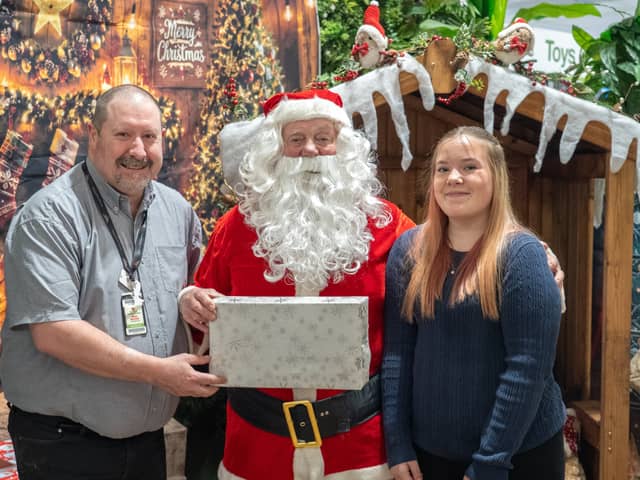 Havant Garden Centre Xmas Area in Havant.  David Craighead, Santa and Primrose Edwards. Picture: Alec Chapman