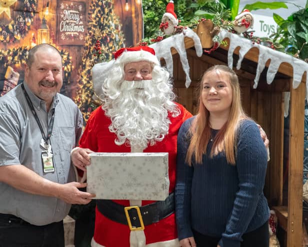 Havant Garden Centre Xmas Area in Havant.  David Craighead, Santa and Primrose Edwards. Picture: Alec Chapman