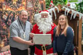 Havant Garden Centre Xmas Area in Havant.  David Craighead, Santa and Primrose Edwards. Picture: Alec Chapman