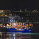 A group of people thought to be migrants are brought in to a marina in Gosport, by the RNLI following a small boat incident in the Channel. Picture date: Sunday October 4, 2026. PA Photo. Photo credit should read: Trevor Adams/PA Wire