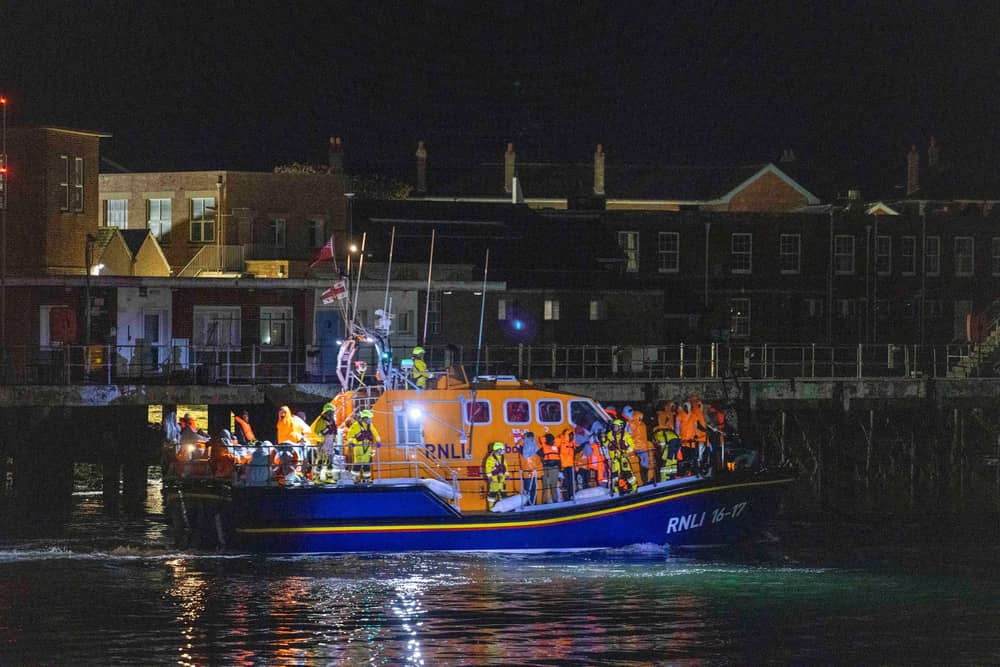 A group of people thought to be migrants are brought in to a marina in Gosport, by the RNLI following a small boat incident in the Channel. Picture date: Sunday October 4, 2026. PA Photo. Photo credit should read: Trevor Adams/PA Wire