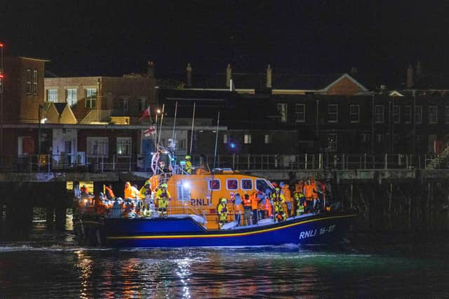 A group of people thought to be migrants are brought in to a marina in Gosport, by the RNLI following a small boat incident in the Channel. Picture date: Sunday October 4, 2026. PA Photo. Photo credit should read: Trevor Adams/PA Wire