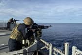 HMS Spey and Tamar will be conducting patrols with international allies in the South China Sea despite previous warnings from Beijing. Pictured: HMS Tamar personnel conducting gunnery exercises.