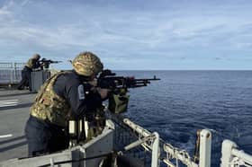 HMS Spey and Tamar will be conducting patrols with international allies in the South China Sea despite previous warnings from Beijing. Pictured: HMS Tamar personnel conducting gunnery exercises.