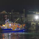 A group of people thought to be migrants are brought in to a marina in Gosport, by the RNLI following a small boat incident in the Channel