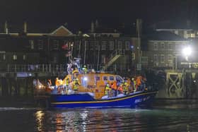 A group of people thought to be migrants are brought in to a marina in Gosport, by the RNLI following a small boat incident in the Channel