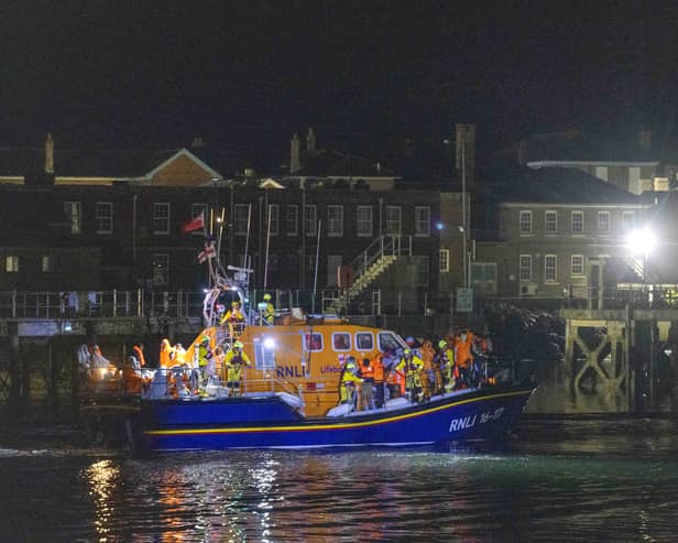 A group of people thought to be migrants are brought in to a marina in Gosport, by the RNLI following a small boat incident in the Channel