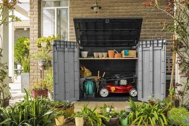 The 1,200-litre unit can hold garden equipment or conceal two 240-litre wheelie bins