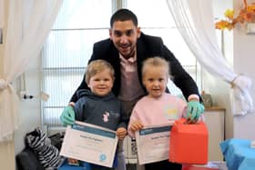 Pharmacist Francisco Millan with Hugo, four, and Elle, three Picture: Habibur Rahman
