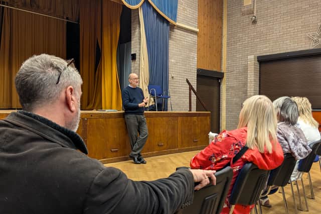 Peter Candlish speaking with residents