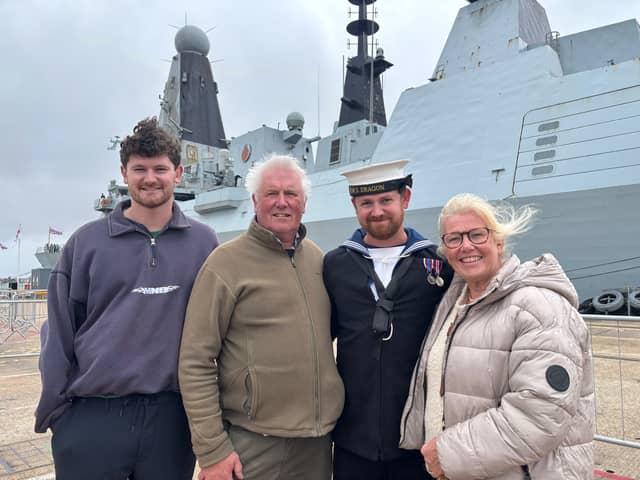 From L-R: Nick Evans (brother), Alan Evans, (father), Leading Seaman Harry Evans and Lesley Evans (mum) reunite after 214 days