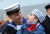 HMS Dragon homecoming on October 9, 2026. Pictured is: Leading Hand Charlie Gill from Littlehampton, West Sussex, with his cousin Finlay Ratan (2). Charlie donated part of his liver to Finlay when he was just four-months-old after needing a transplant.
