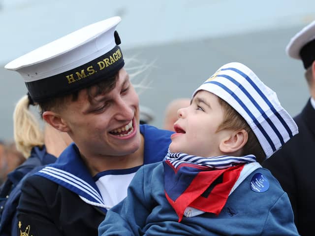 HMS Dragon homecoming on October 9, 2026. Pictured is: Leading Hand Charlie Gill from Littlehampton, West Sussex, with his cousin Finlay Ratan (2). Charlie donated part of his liver to Finlay when he was just four-months-old after needing a transplant.