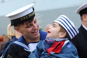 HMS Dragon homecoming on October 9, 2026. Pictured is: Leading Hand Charlie Gill from Littlehampton, West Sussex, with his cousin Finlay Ratan (2). Charlie donated part of his liver to Finlay when he was just four-months-old after needing a transplant.