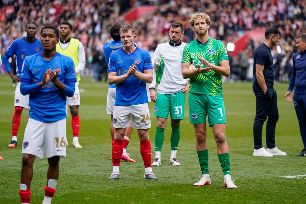 The Pompey players applaud the away fans at the final whistle