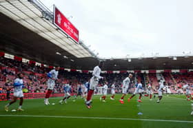 Madiodio Dia warms up with his Pompey team-mates ahead of the south-coast derby v Southampton