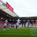 Madiodio Dia warms up with his Pompey team-mates ahead of the south-coast derby v Southampton