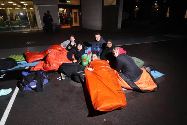 Portsmouth Grammar School students sleeping outside on school grounds.