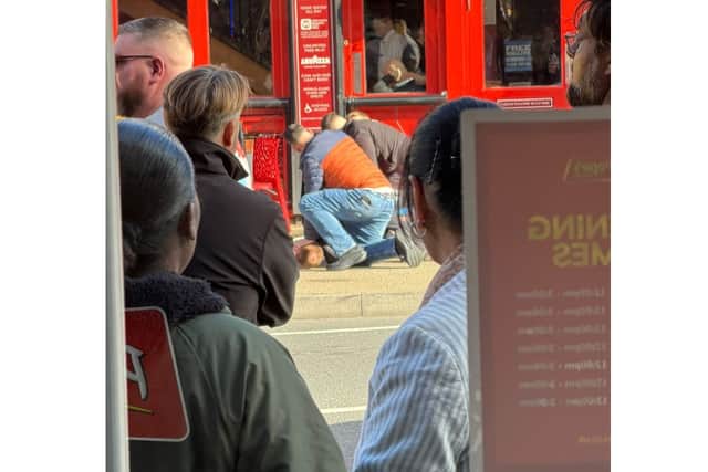 A man was pinned to the ground in London Road outside the Sir John Baker in North End