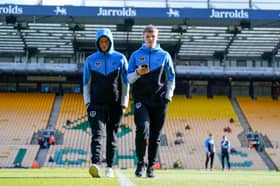 Ben Killip, left, has named on the Pompey bench for today's game at Norwich alongside fellow goalkeeper Daniel Bielica and Terry Devlin, right.